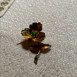 Elegant Gold Flower Brooch with Green Accent